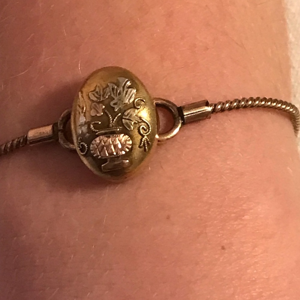 Vintage antique gold tricolor bracelet with bird and flower pot.